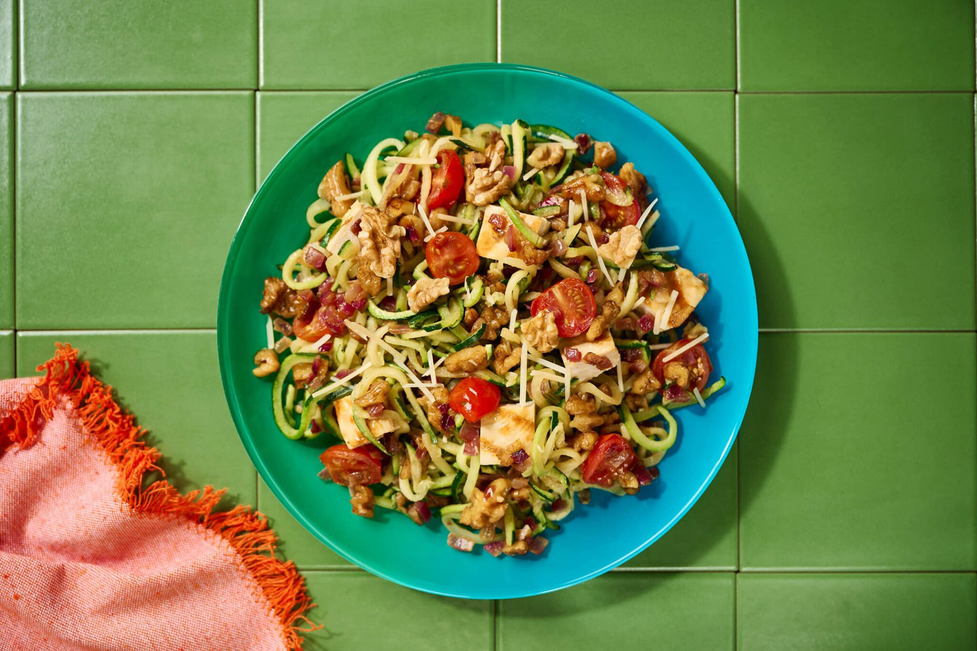 Warm Parmesan Zucchini Noodles with Chicken, Tomatoes and Walnuts