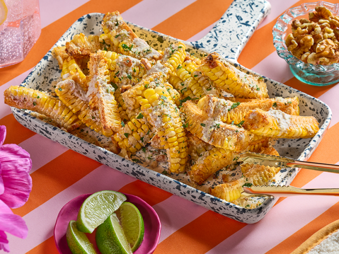 Smoked Paprika-Spiced Corn Ribs with Walnut Parmesan and Walnut Lime Crema