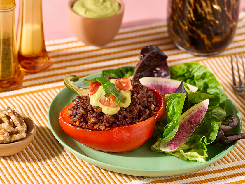 Walnut Chorizo Stuffed Bell Peppers with Avocado Crema